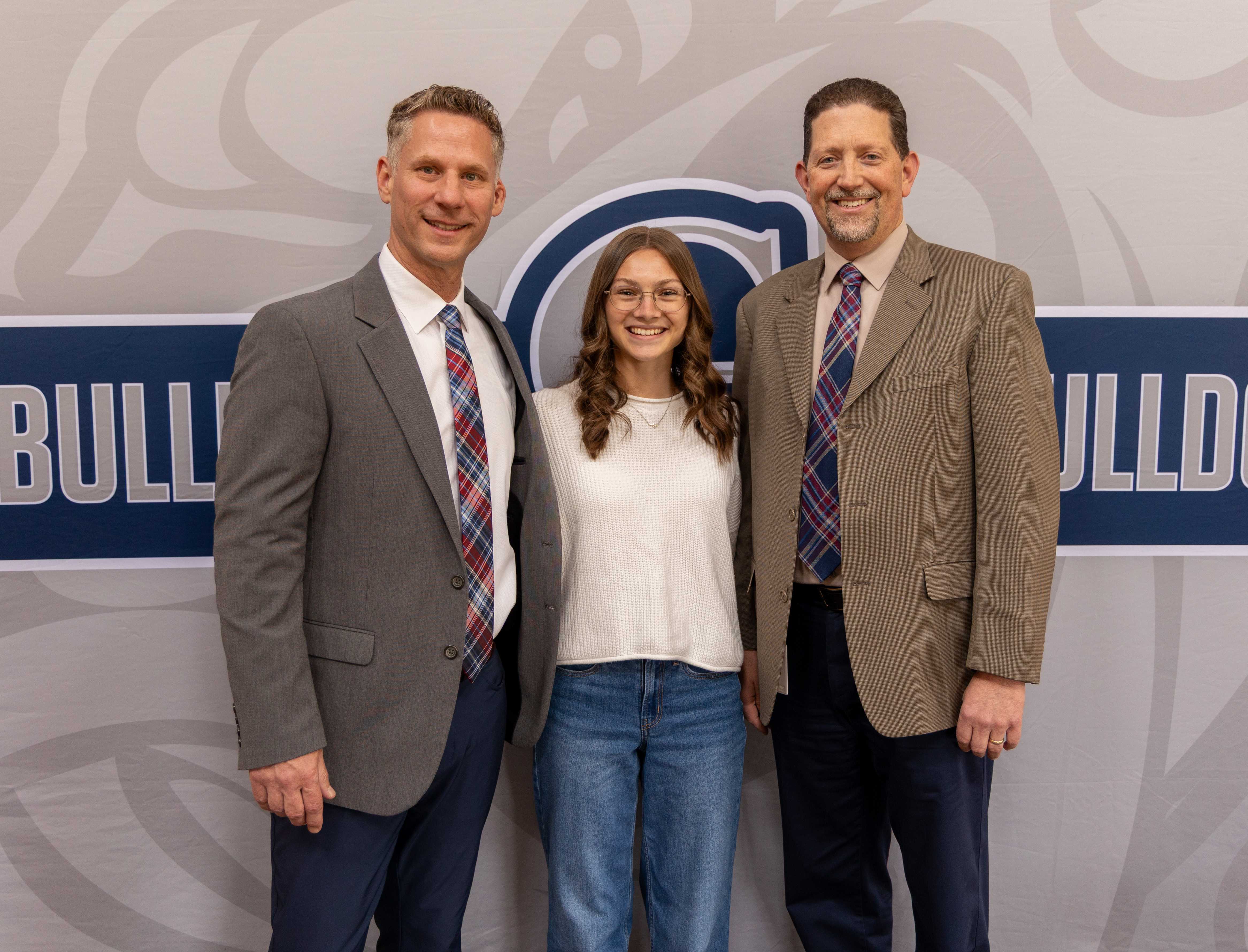 Ava Yorke poses with Principal Barr and Superintendent Sickles